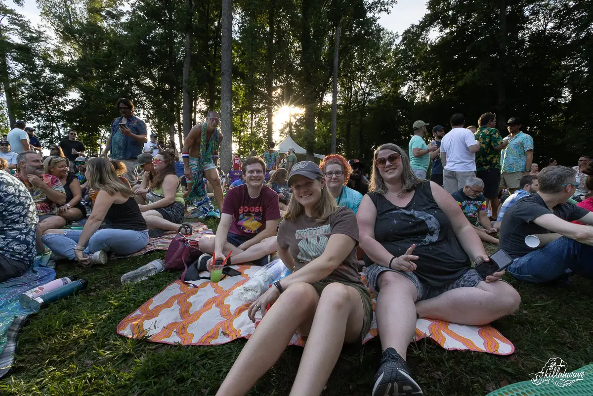 Fans wait for Goose under the canopy of trees | The Chrysalis at Merriweather Park