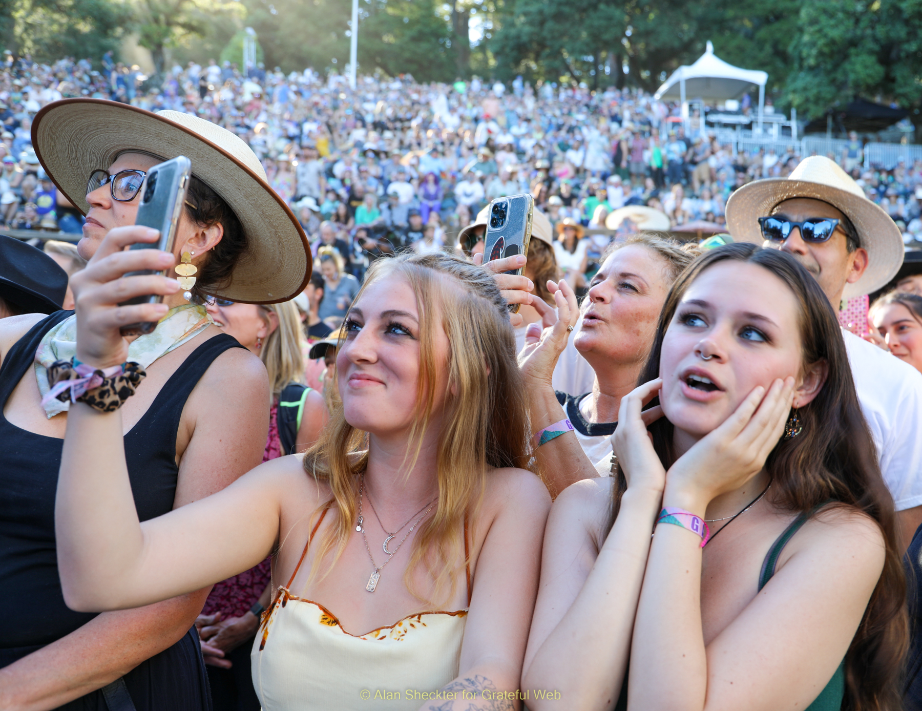 Emma Brigham (right), enjoys Lord Huron’s set with her best friend and her mother. 