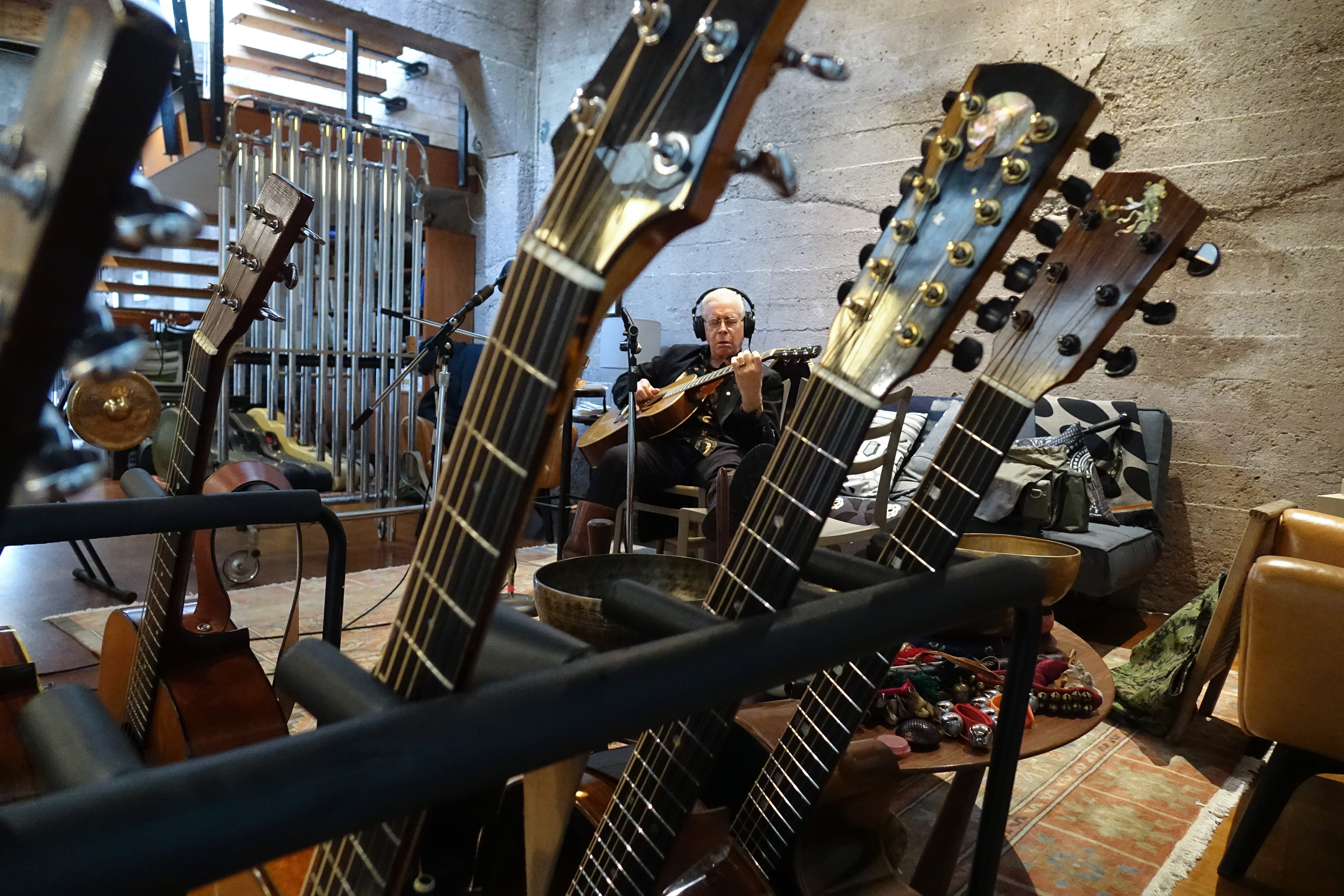 Bruce Cockburn with guitar arsenal | Photo courtesy of the artist