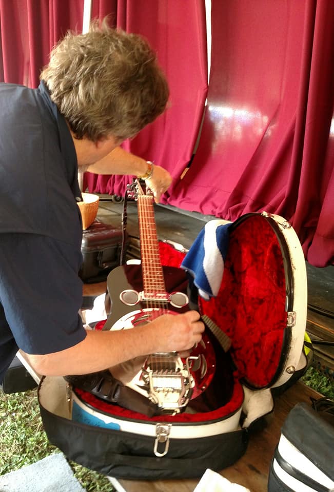 Jerry Douglas tuning his dobro in Catskill Tent