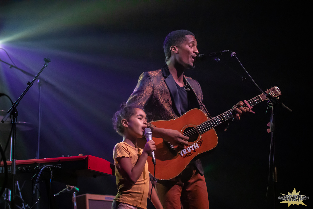 Ron Artis II with his daughter on stage in Fort Collins, CO