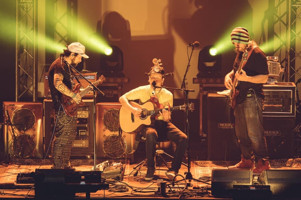 Brook Jordan (center), leaves the kit for an acoustic “Dusk ‘Til Dawn”   Photo Credit:  Dave DeCrescente 