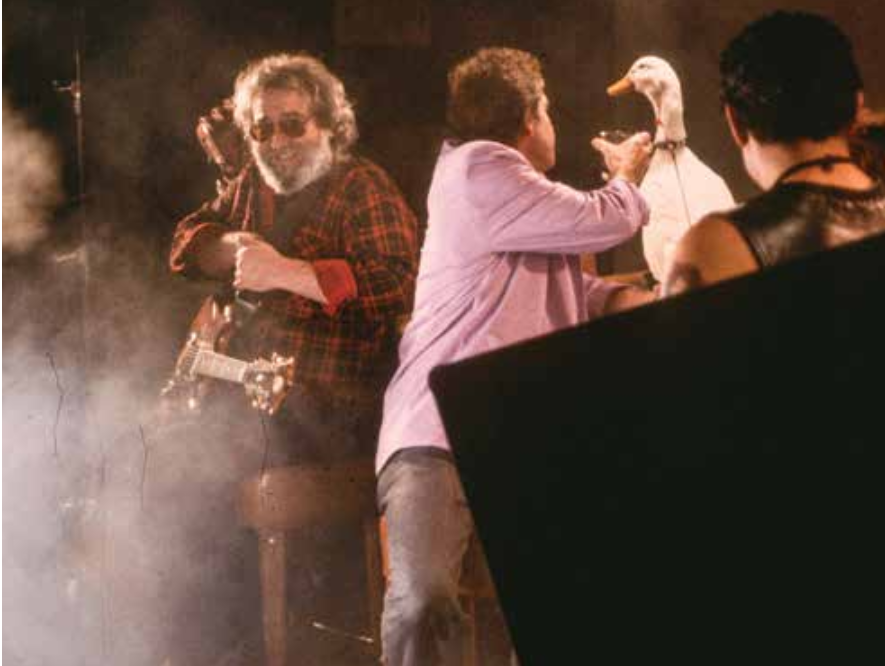 Jerry and Bobby offering The Duck a drink, on the set of official music video for “Hell in a Bucket.” August 1987. Photo courtesy ©Susana Millman