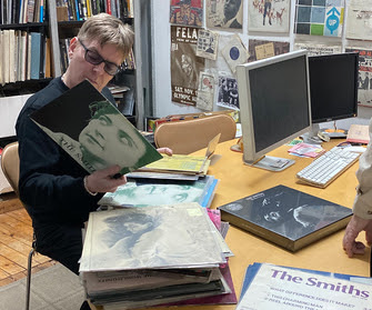Andy Rourke of the Smiths @ ARC looking at Smiths LPs he's never seen