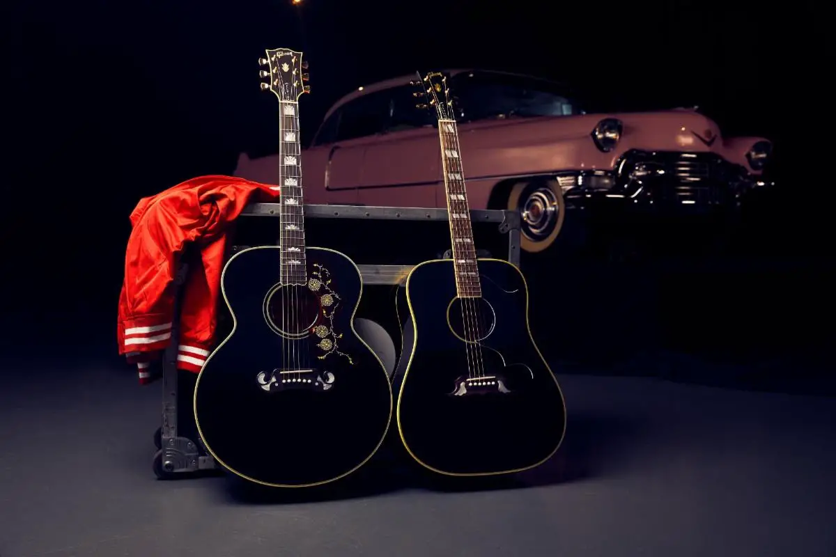 Above (L-R): the Gibson Elvis SJ-200 and the Elvis Dove with Elvis’ pink Cadillac in the background at Graceland.