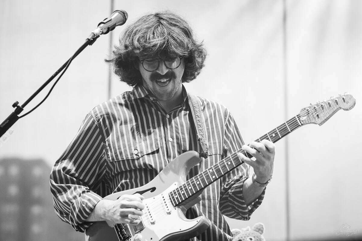 Multi-instrumentalist Peter Anspach played guitar during "No Rain" | Goose