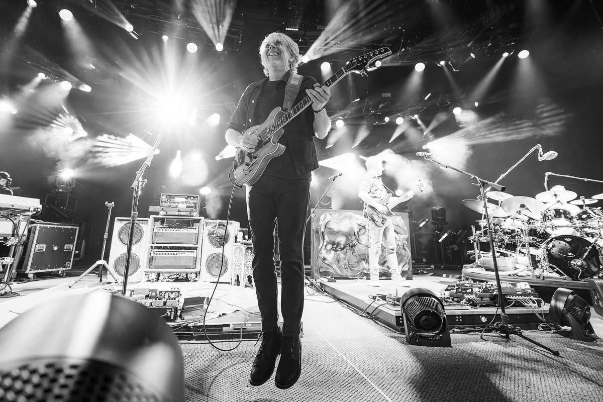 Guitarist Trey Anastasio catches air during "First Tube" | Phish