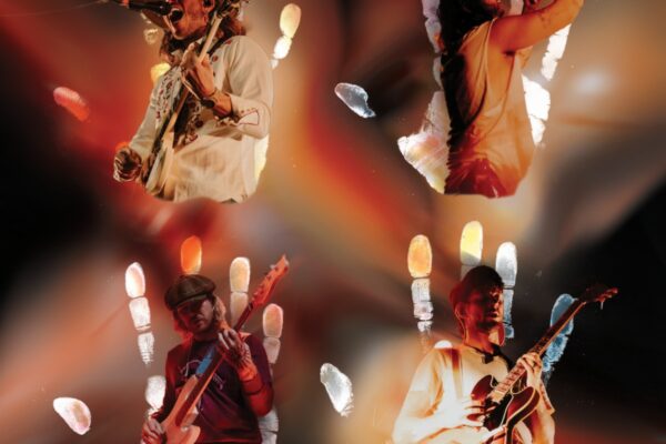 Four musicians performing on a colorful, abstract-lit stage with guitars and a microphone.