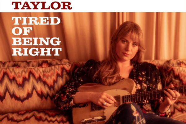 Album cover: Joanne Shaw Taylor's 'Tired of Being Right' featuring a woman with an electric guitar on a patterned sofa.