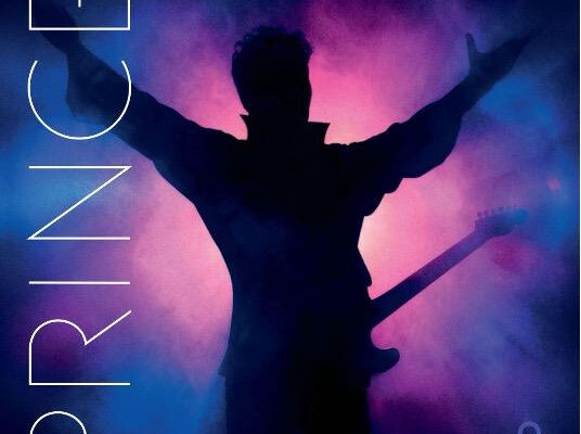Album cover showing a guitarist silhouette with arms raised, neon blue–pink stage lights; vertical text 'ICONIC' on left and 'TIMELESS' at top right.