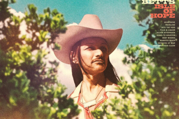 Album cover: man in a pink cowboy hat outdoors, blue sky and greenery, with 'DUANE BETTS ISLE OF HOPE' text on the right and track list.