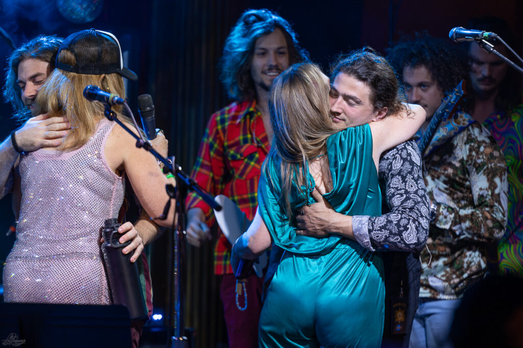 Joey Babbick and Denise Nadboy embrace | Dogs in a Pile