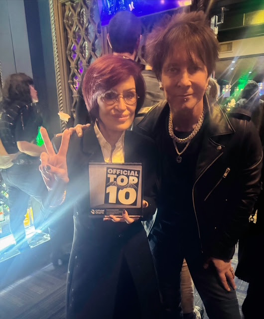BILLY MORRISON Presents Sharon Osbourne With Ozzy Osbourne’s Official Award For The Top 10 Vinyl Hit Single “Gods Of Rock N Roll”